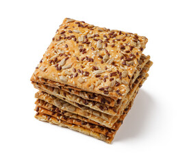 Crispy snack layered with seeds displayed on a white surface in a well-lit setting