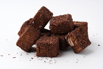 Chocolate treat cubes stacked on a white background showcasing rich texture and appealing appearance