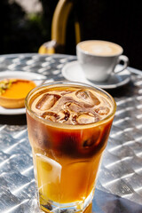 iced coffee with orange juice in the cafe