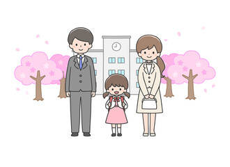 入学式　校舎の前に立つ女の子と両親