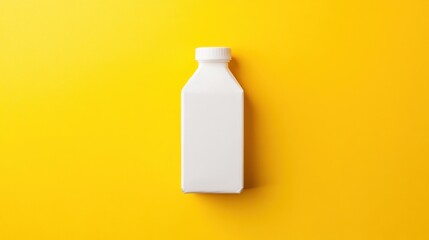 White plastic bottle on yellow background.