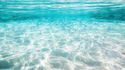 Obraz premium Turquoise water showcases sunlight reflections, creating a tranquil atmosphere for relaxation and enjoyment beneath the surface