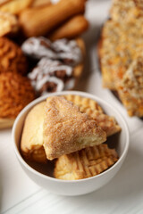 Delicious assortment of pastries and treats displayed in a bowl and on a table