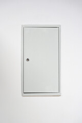 Door with a simple design against a white wall in a minimalistic setting