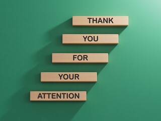 Attention symbol. Wooden blocks with words Thank you for your attention.Business and Thank you for your attention concept.Copy space.3D rendering on green background.