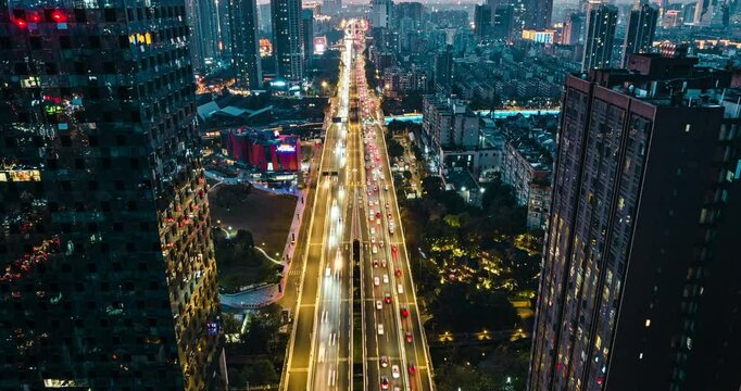 aerial view urban cityscape timelapse of traffic on the road with high buildings modern city of Chengdu China at twilight