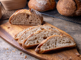 Sliced Artisan Sourdough Bread on Wooden Table.