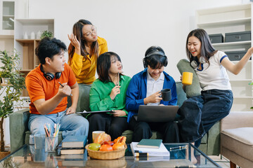 Obraz premium Learning online working concept. Asian college student working on tablet and laptop computer, searching knowledge in home.