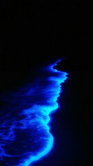 A captivating digital artwork showcasing glowing bioluminescent waves undulating gracefully across a pitch-black background. 