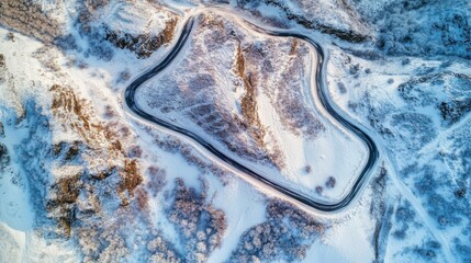 Winding road creates a stunning scene in a snowy landscape. Nature reveals the beauty of winter. Aerial view captures the essence of this serene journey. Generative AI
