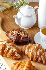 croissants on a board with tea
