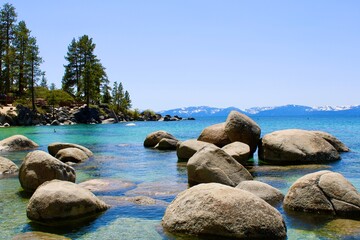 Rocks submerged and on the water of Lake Tahoe