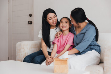 Family celebrates love and joy in home adoption moment between two mothers and their daughter