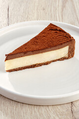 chocolate cheesecake with truffle on a board