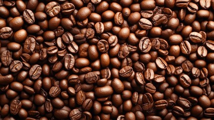 Obraz premium Coffee beans. Fresh roasted coffee beans. Dark. Brown. Caffeine. Aroma. Vibrant coffee bean background. Scattered grains