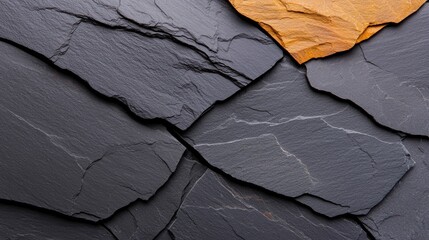 A textured background of overlapping slate tiles in shades of gray and orange.