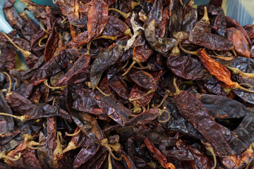 Guajillo chili on supermarket shelves.Variety of chili peppers on supermarket shelves in Mexico