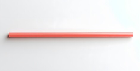 A single coral colored cylindrical object rests on a white background