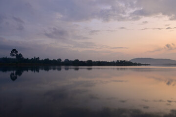 Dramatic sunset sky with clouds, picturesque field and scenic road, Russian landscape. Sky and clouds