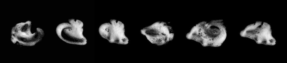 Isolated on a white background, a heap of foamy, soapy suds, created by shampoo and body wash, forms a thick, fluffy texture in the shape of bubbles, their abstract pattern and transparent surface
