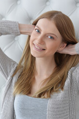Naklejka premium Beauty portrait. Young woman on grey wall background.