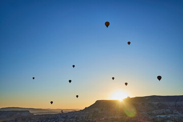 Balloons lifted into the air in Cappadocia. Entertainment and tourist attraction. A spectacular sight
