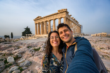 Selfie photo of a tourist couple in Parthenon ancient historic city