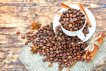 Savoring the rich aroma of coffee beans and spices on a rustic wooden table