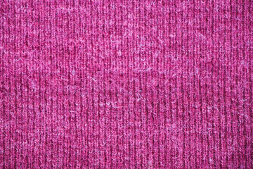 Knitting pattern in pink color. Abstract background and texture for design.