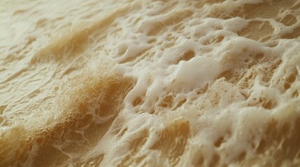 A close-up of ocean waves crashing, showcasing the foam and natural textures.