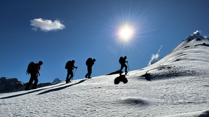 wonderful hiking and sports team in the magnificent atmosphere of the snowy mountains