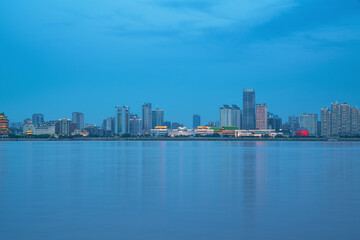 Fototapeta premium The urban skyline and Ganjiang River scenery of Nanchang City, Jiangxi Province, China on April 1, 2024