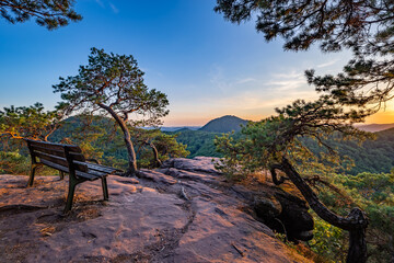 Bench on Rock Slevogtfelsen with View of Palatinate Forest during Sunset, Rhineland-Palatinate, Germany, Europe