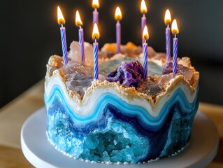 Colorful gemstone birthday cake with candles creates a festive atmosphere during a celebration