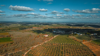 Aerial View of Landscape: An expansive aerial vista showcases a diverse landscape, with sprawling...