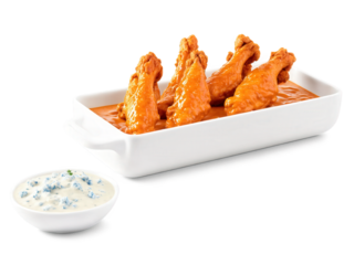 Spicy buffalo chicken wings coated in bright orange sauce, bold blue cheese dip, striking color contrast, suspended animation, punchy visuals