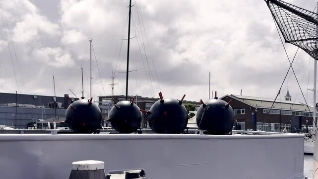 Reminder of Maritime Dangers Naval Mines on Display at the Den Helder Marine Museum, Silent Sentinels of the Sea Under a Cloudy Sky Den Helder, Netherlands Dutch minesweeper Abraham Crijnssen