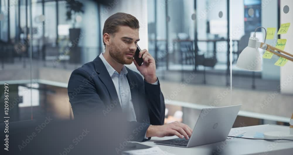Poster young entrepreneur negotiating a deal on phone while checking emails on laptop computer. confident a
