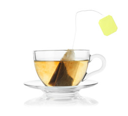 Brewing aromatic tea. Cup with teabag isolated on white