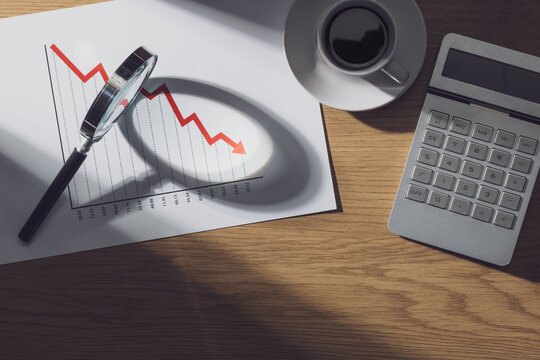 Financial chart showing negative trend and magnifier