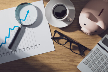 Financial chart showing positive trend and magnifier