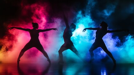 Three dancers perform striking poses in a vibrant atmosphere filled with colorful smoke. The energetic scene highlights movement and creativity in a lively setting
