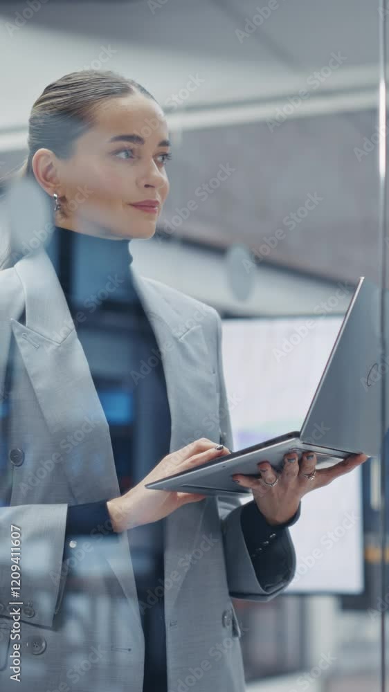 Aufkleber vertical screen: woman working on laptop computer in a bright and modern office. young manager in a 