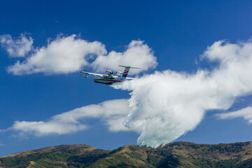 Beriev Be-200ES. - Russian multipurpose amphibious aircraft. Plane performs aerobatics against...