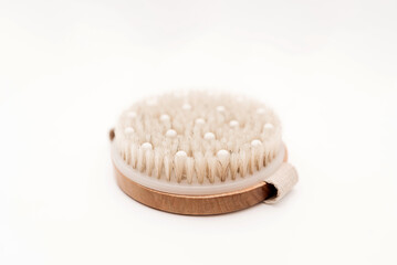 Dry brushing body brush for wellness and skincare on white background