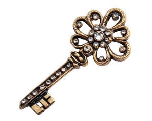 vintage brooch featuring key motif with decorative elements and gemstones, perfect for adding touch of elegance to any outfit