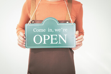 A barista girl opens a cozy coffee shop, equipped with a coffee machine and various tools. She earns extra income by taking online coffee orders, blending passion with modern convenience.