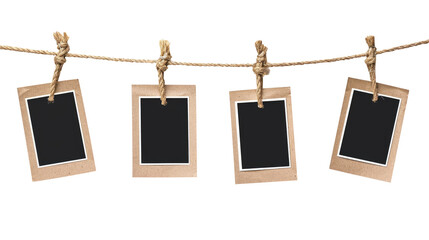 Four blank instant photo frames hanging on a rope isolated on transparent background, Png file
