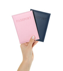 Woman holding passports in color covers on white background, closeup
