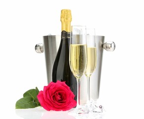 Champagne in glasses, bottle, beautiful rose and ice bucket isolated on white